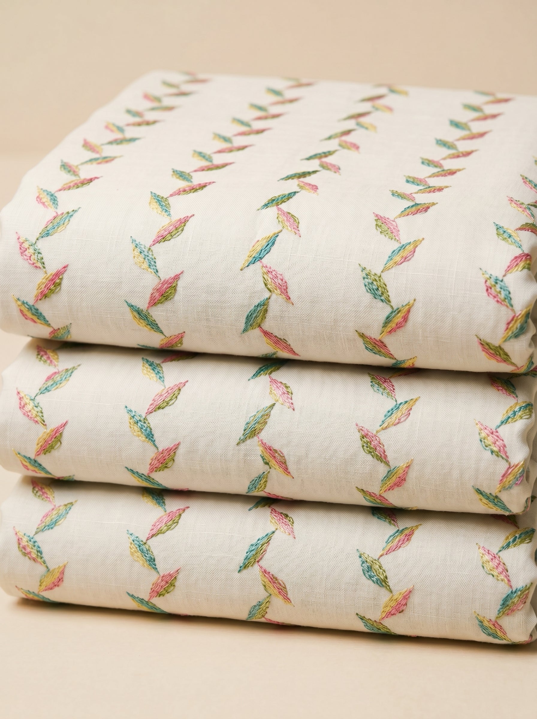 Multicolour embroidery on soft white cotton