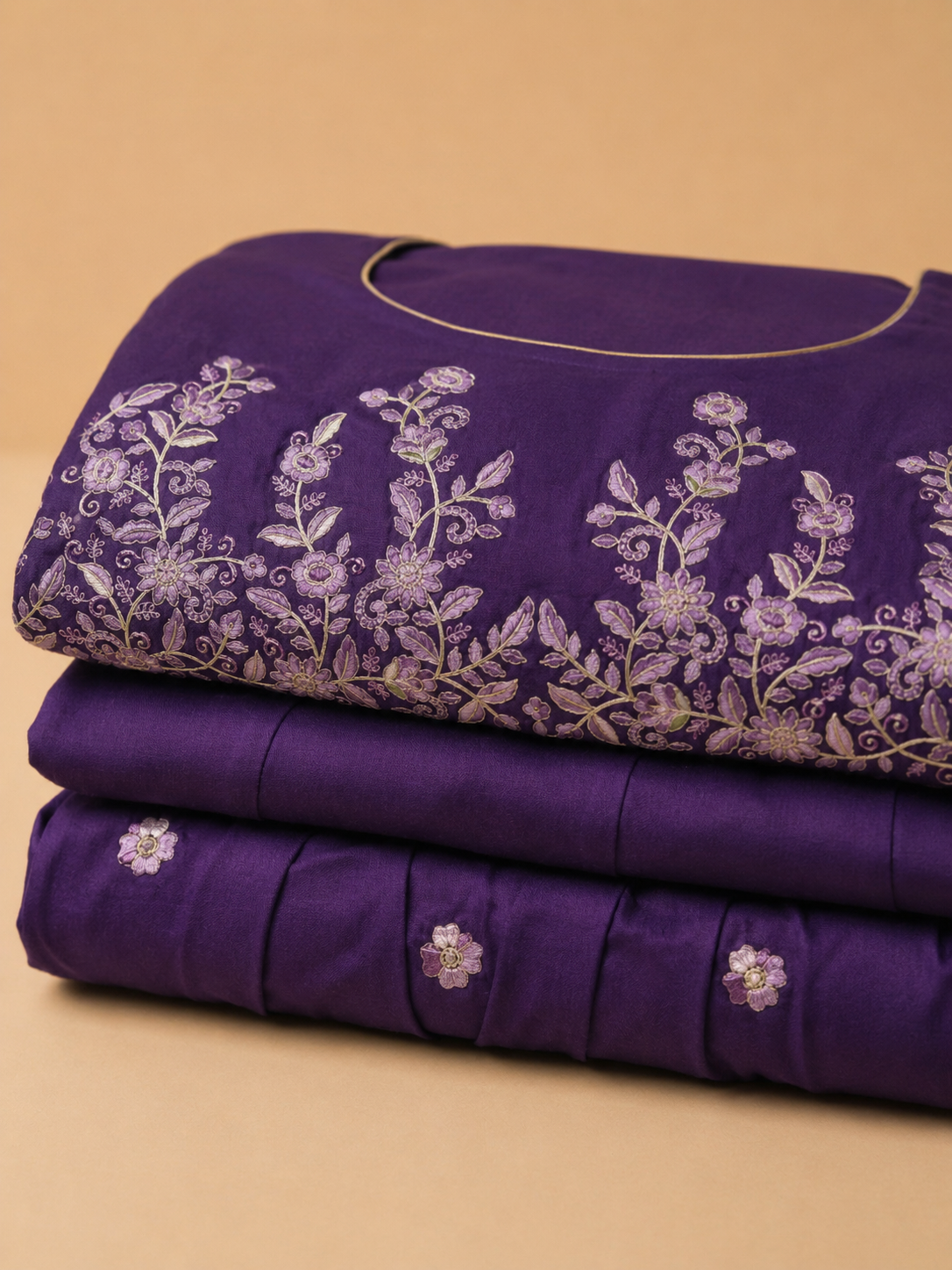Delicate floral embroidery on a rich royal purple base
