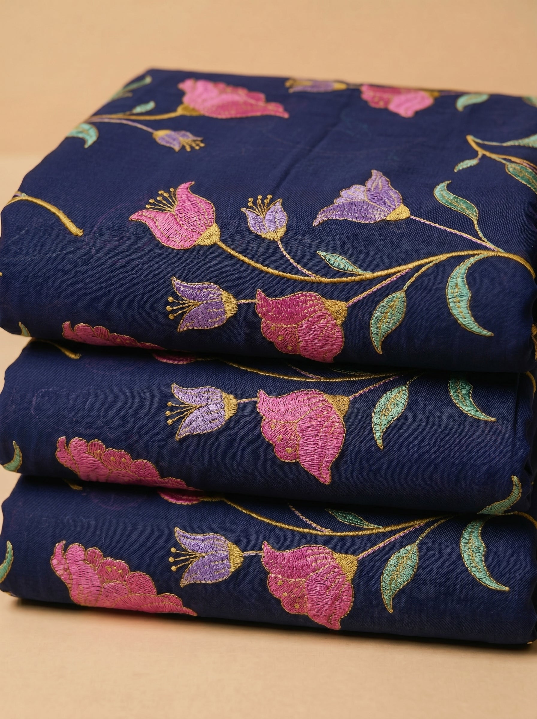 Vibrant floral embroidery on deep navy voile