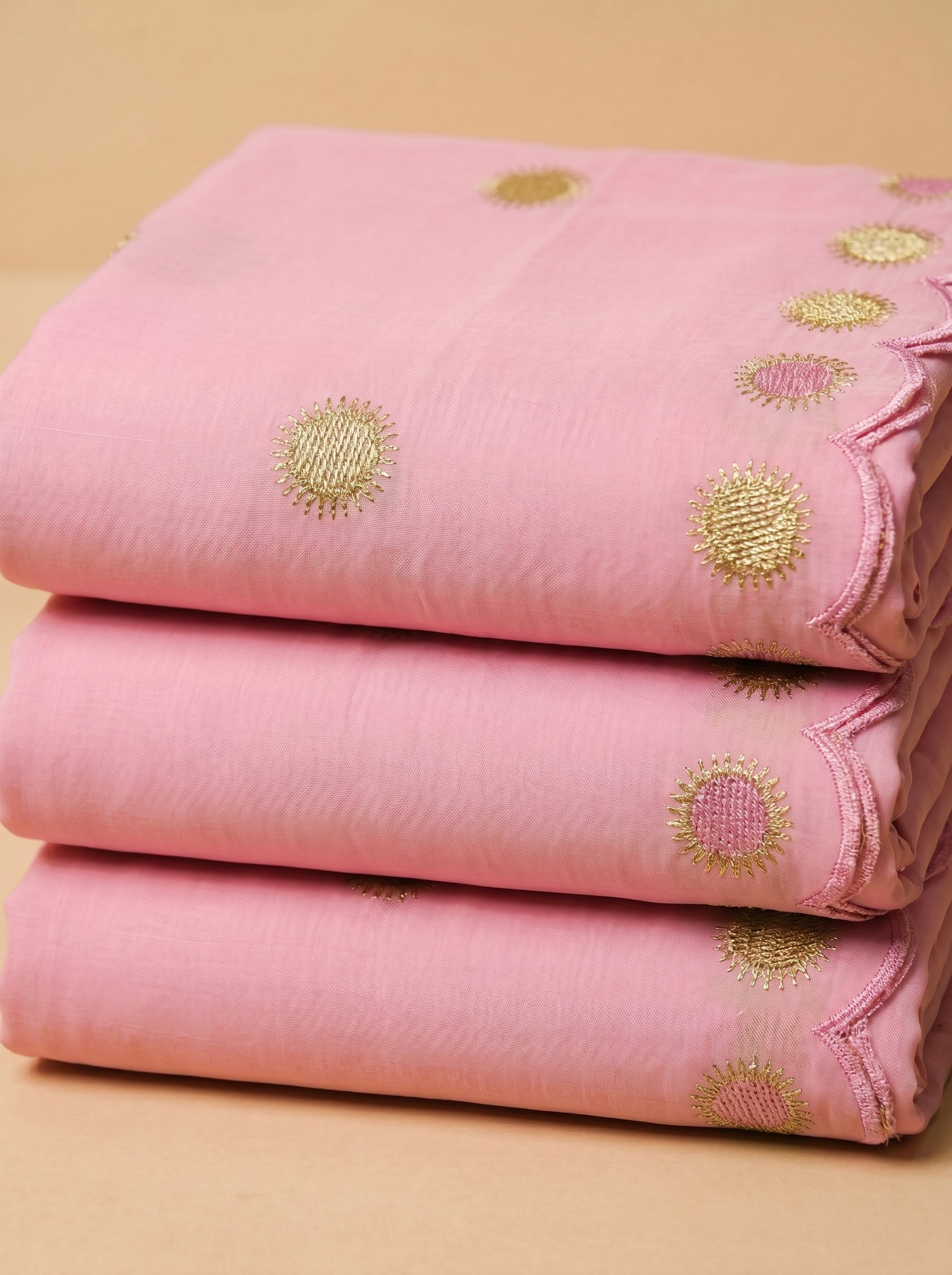 Soft pink Swiss voile with signature sunburst embroidery