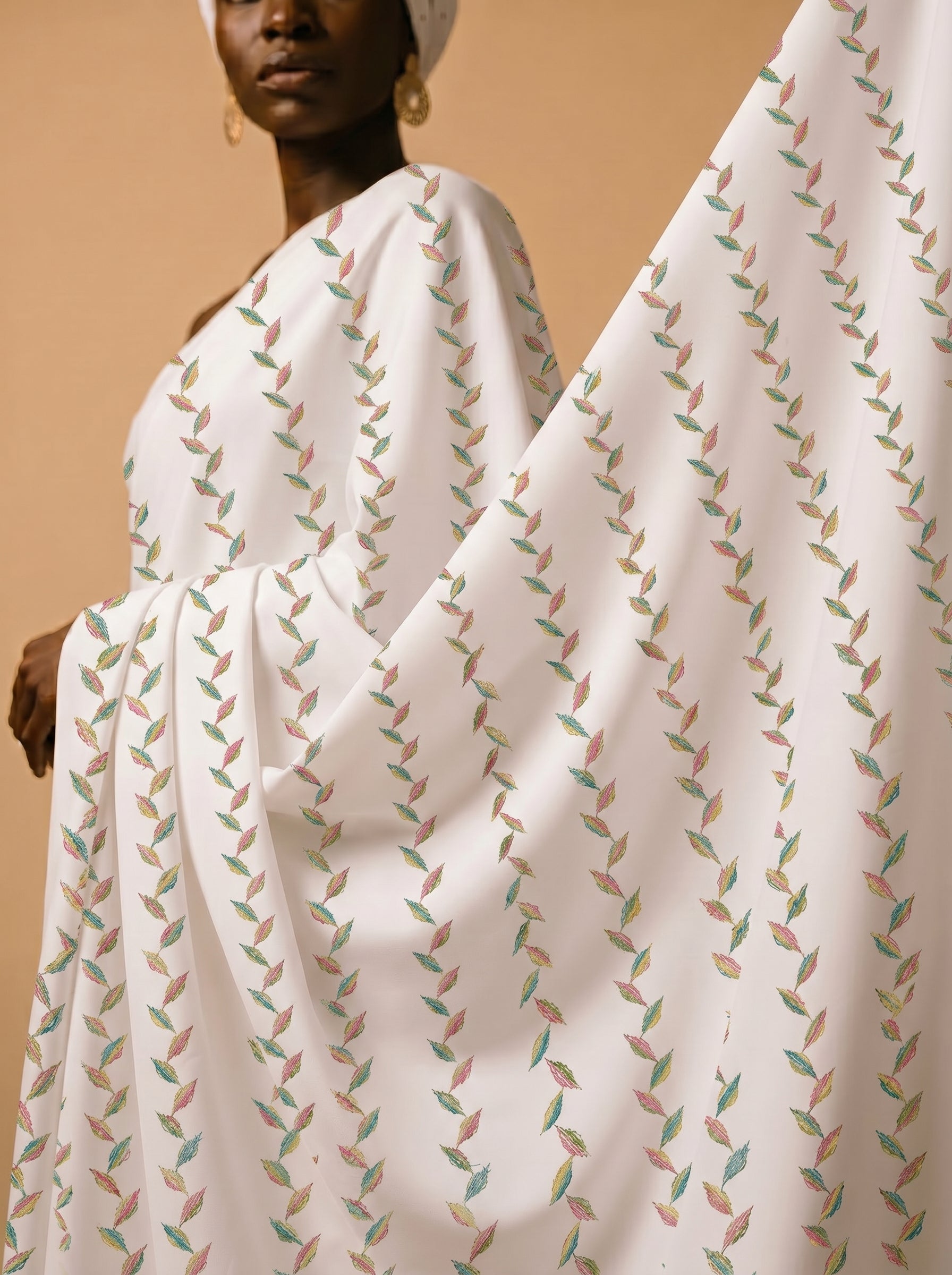 Multicolour embroidery on soft white cotton