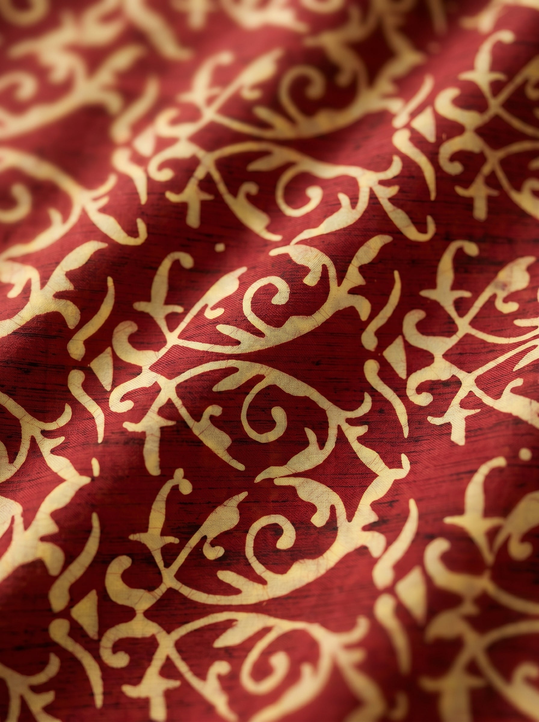 Earthy batik swirls on rich maroon