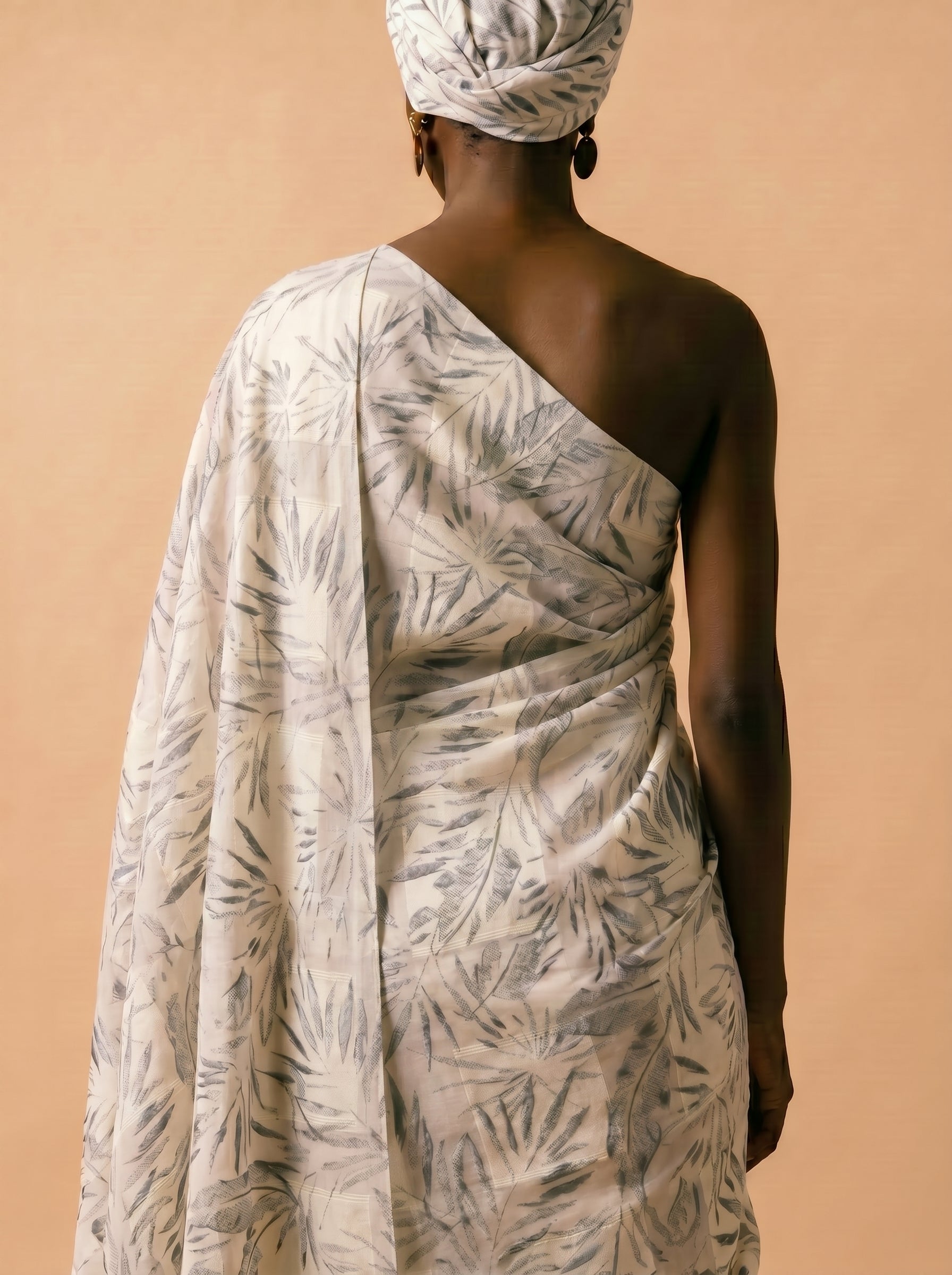 Unstitched Swiss voile featuring nature-inspired leaf motifs and intricate embroidery work