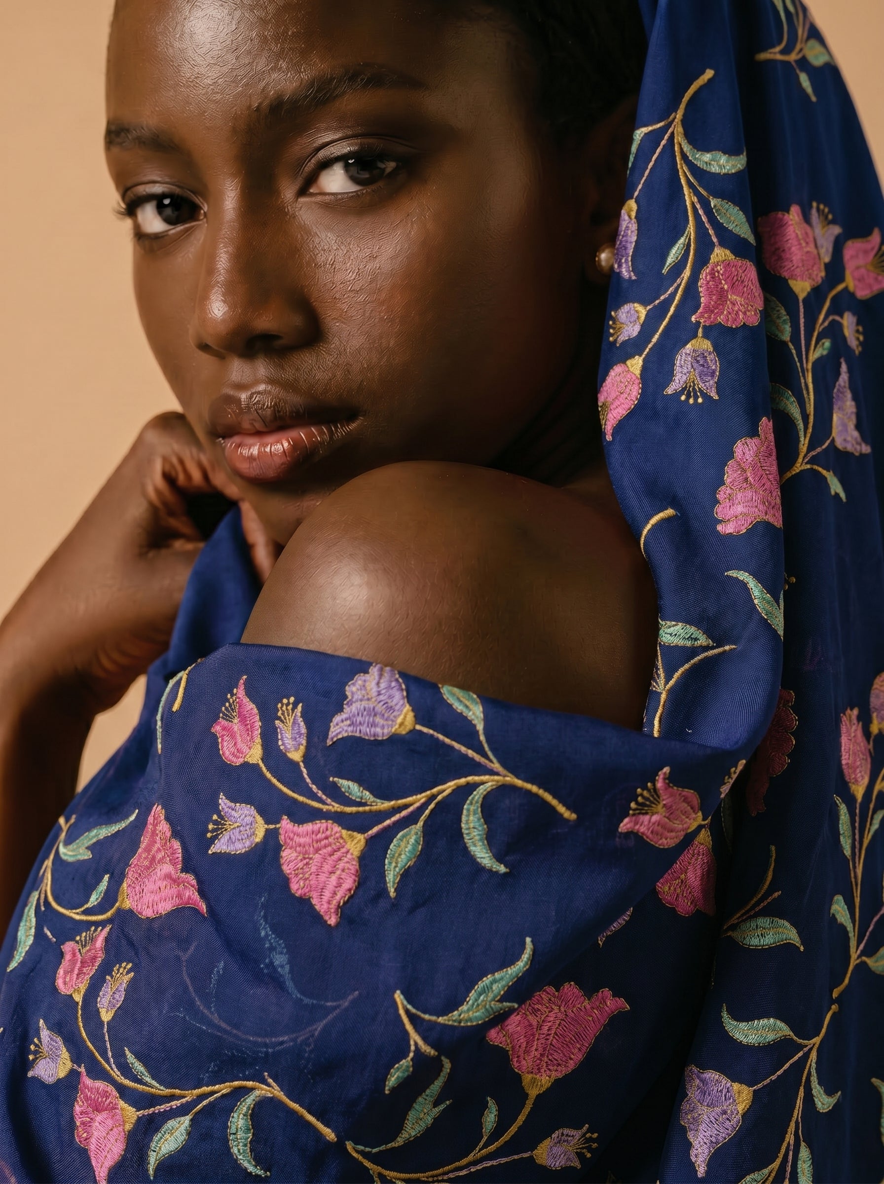 Vibrant floral embroidery on deep navy voile