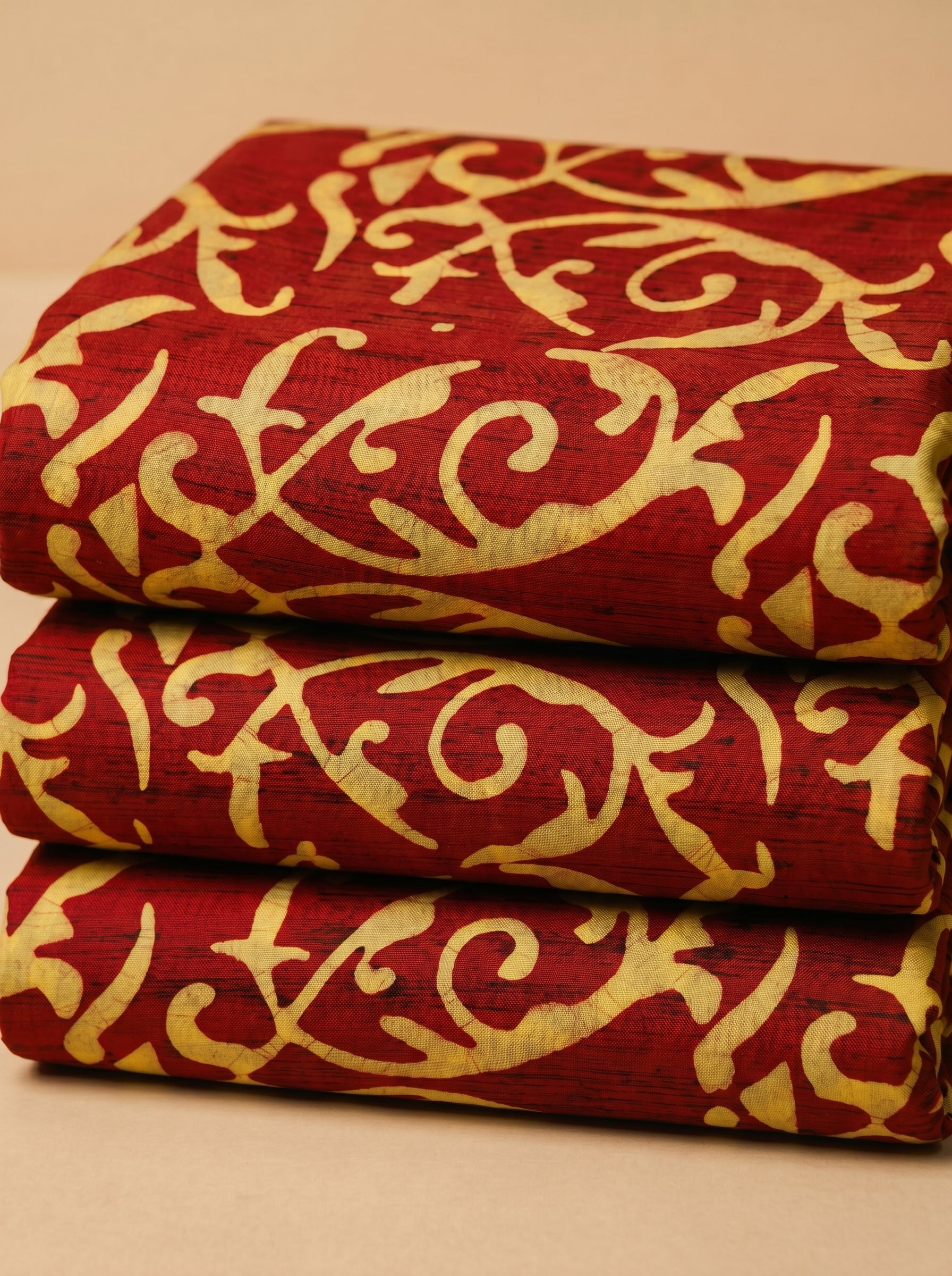 Earthy batik swirls on rich maroon