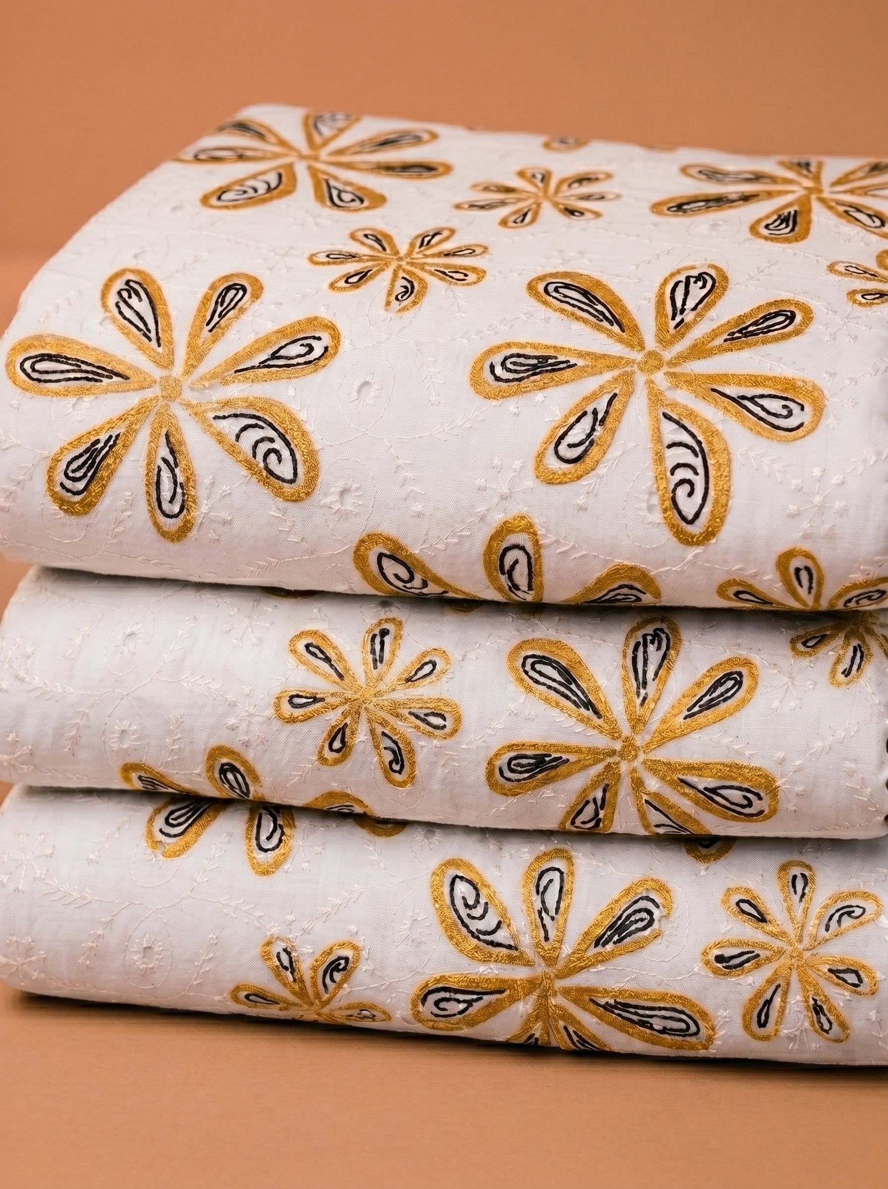 Embroidered motif fabric