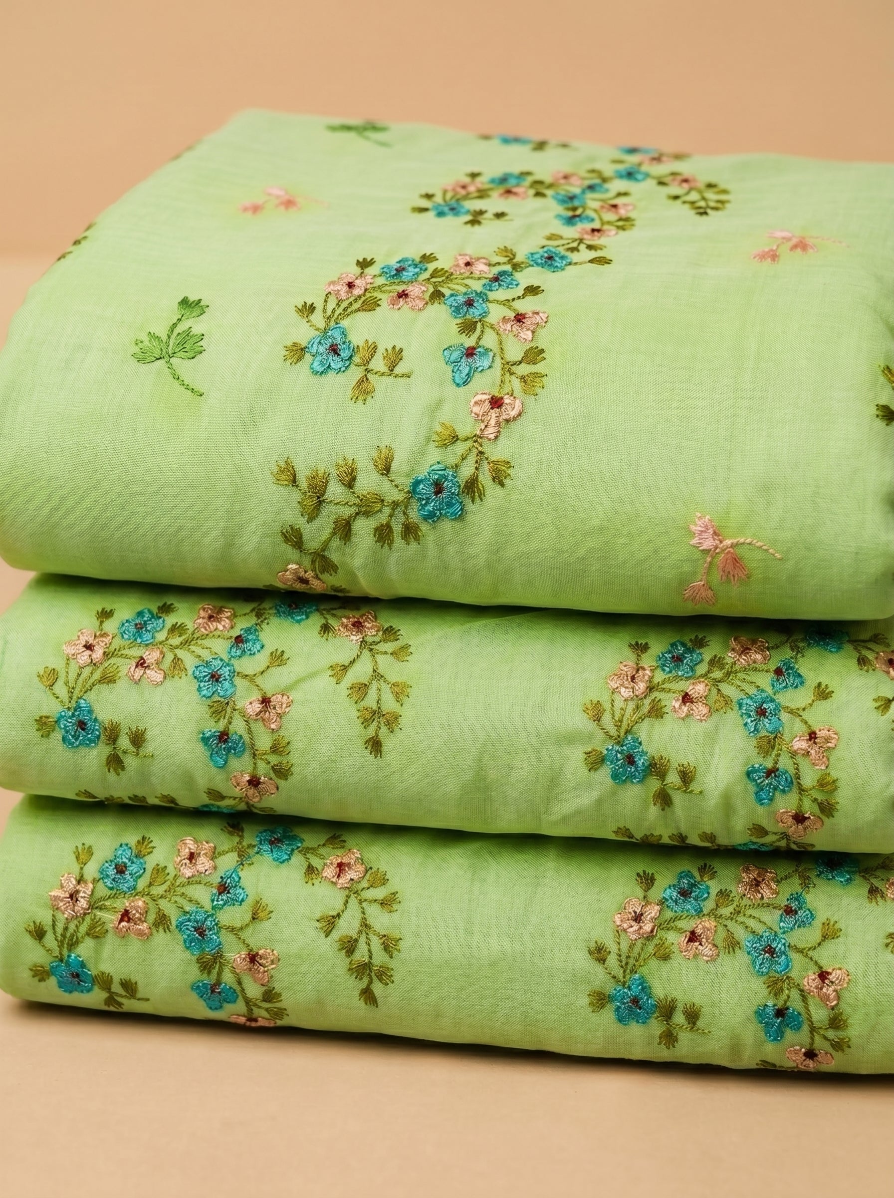 Fresh lime base with delicate floral embroidery