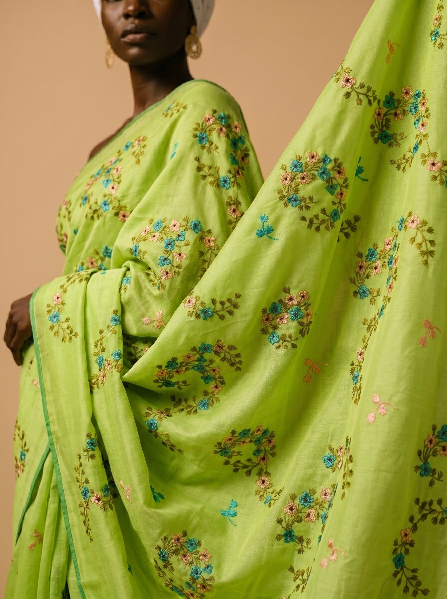 Fresh lime base with delicate floral embroidery