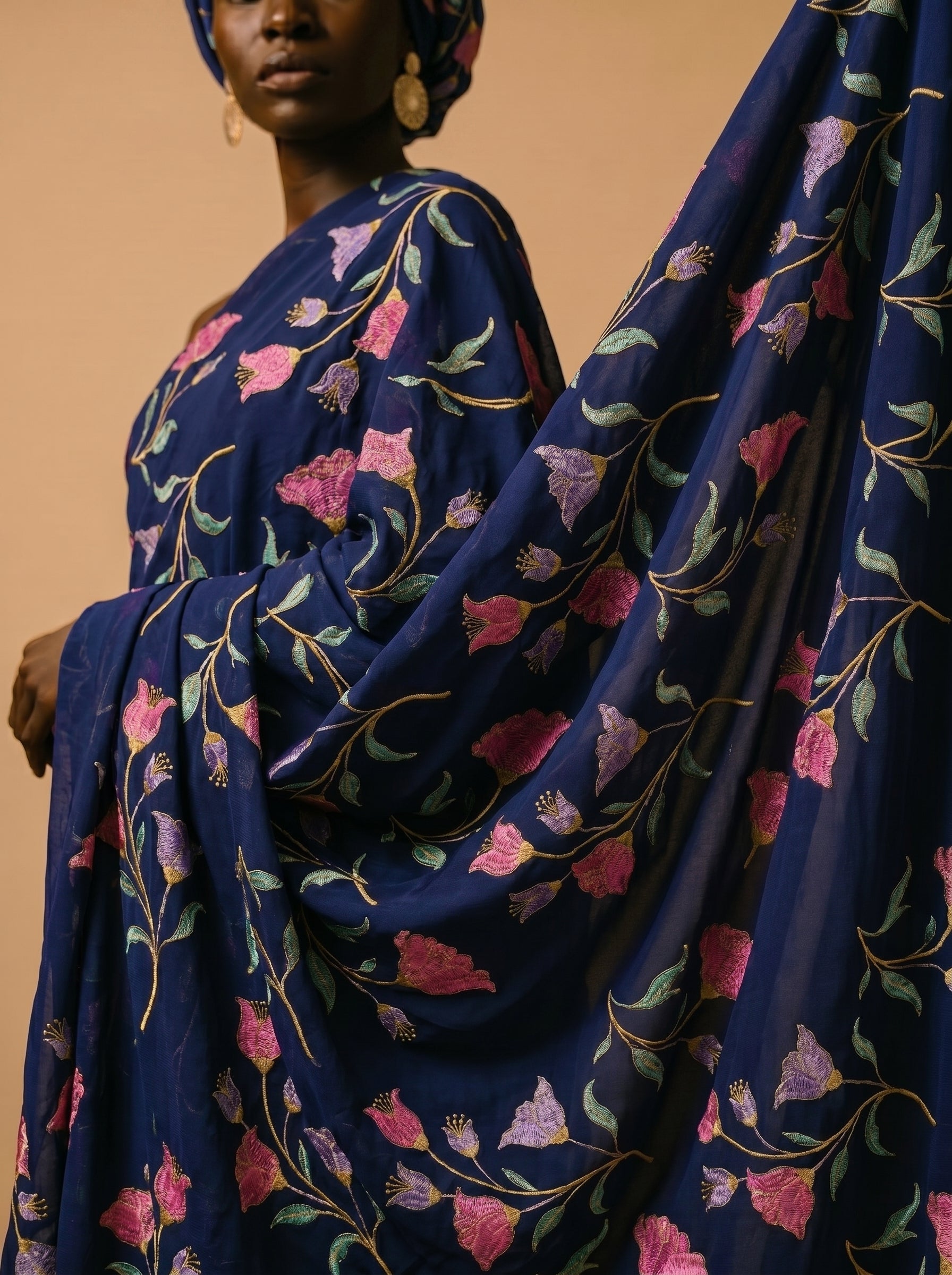 Vibrant floral embroidery on deep navy voile