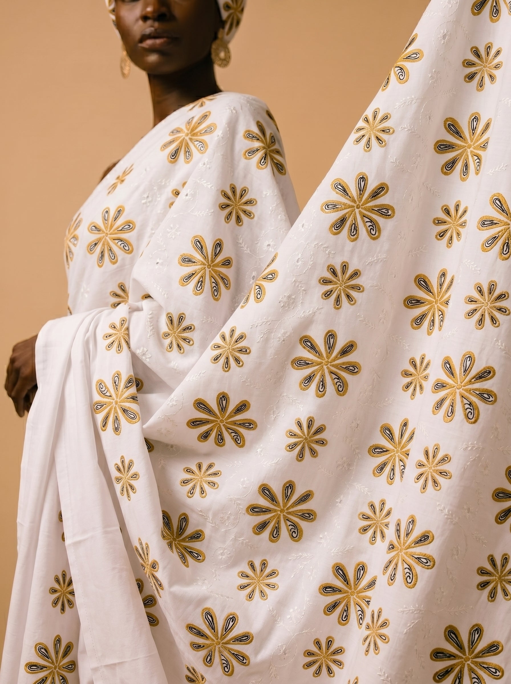 Embroidered motif fabric