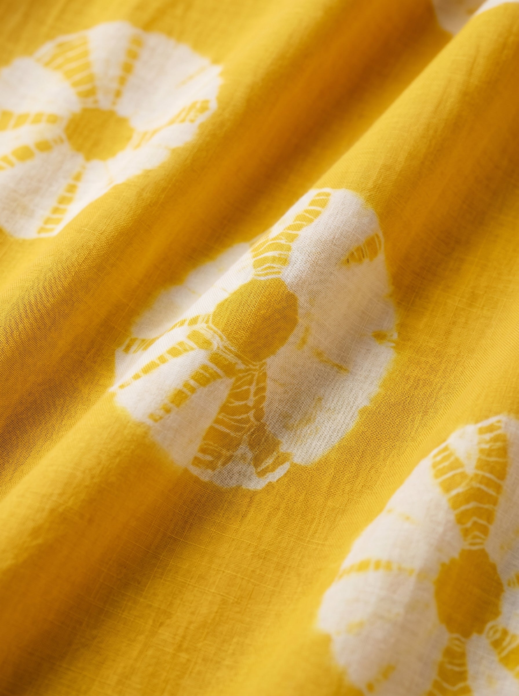 Bold tie-dye design with signature patterns