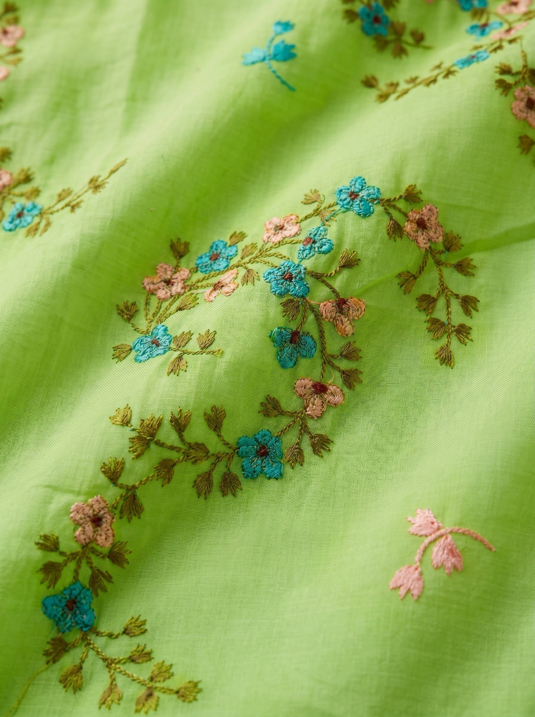 Fresh lime base with delicate floral embroidery