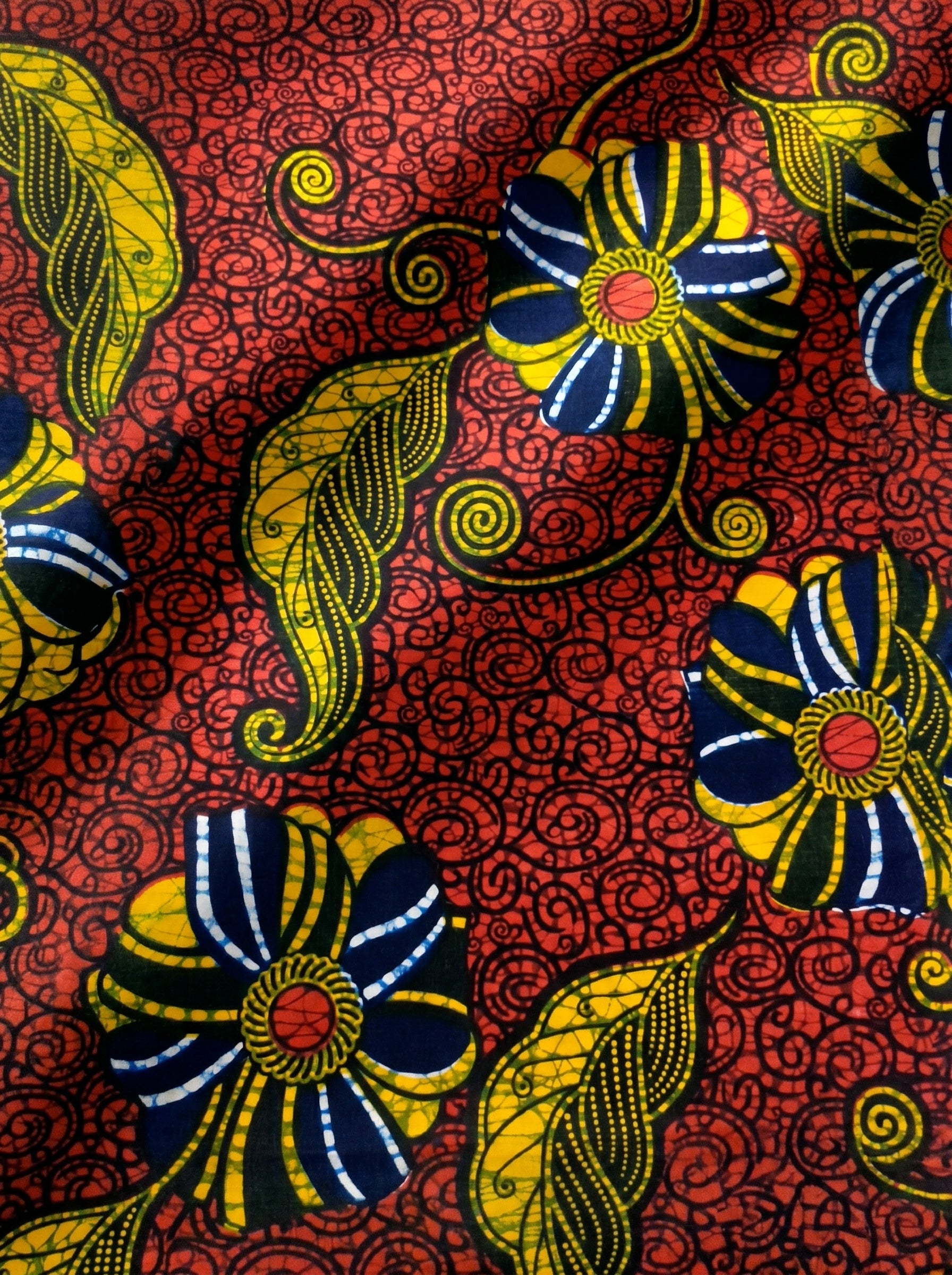 Bold floral wax print on rich red