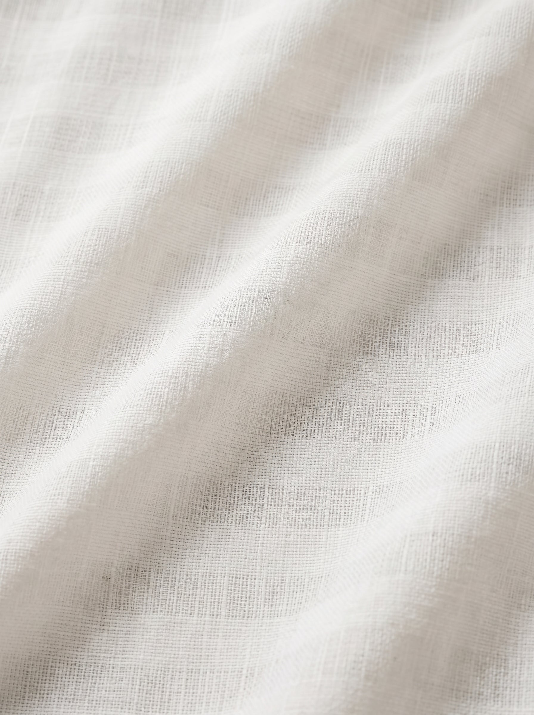 Visible pattern weave in soft white fabric