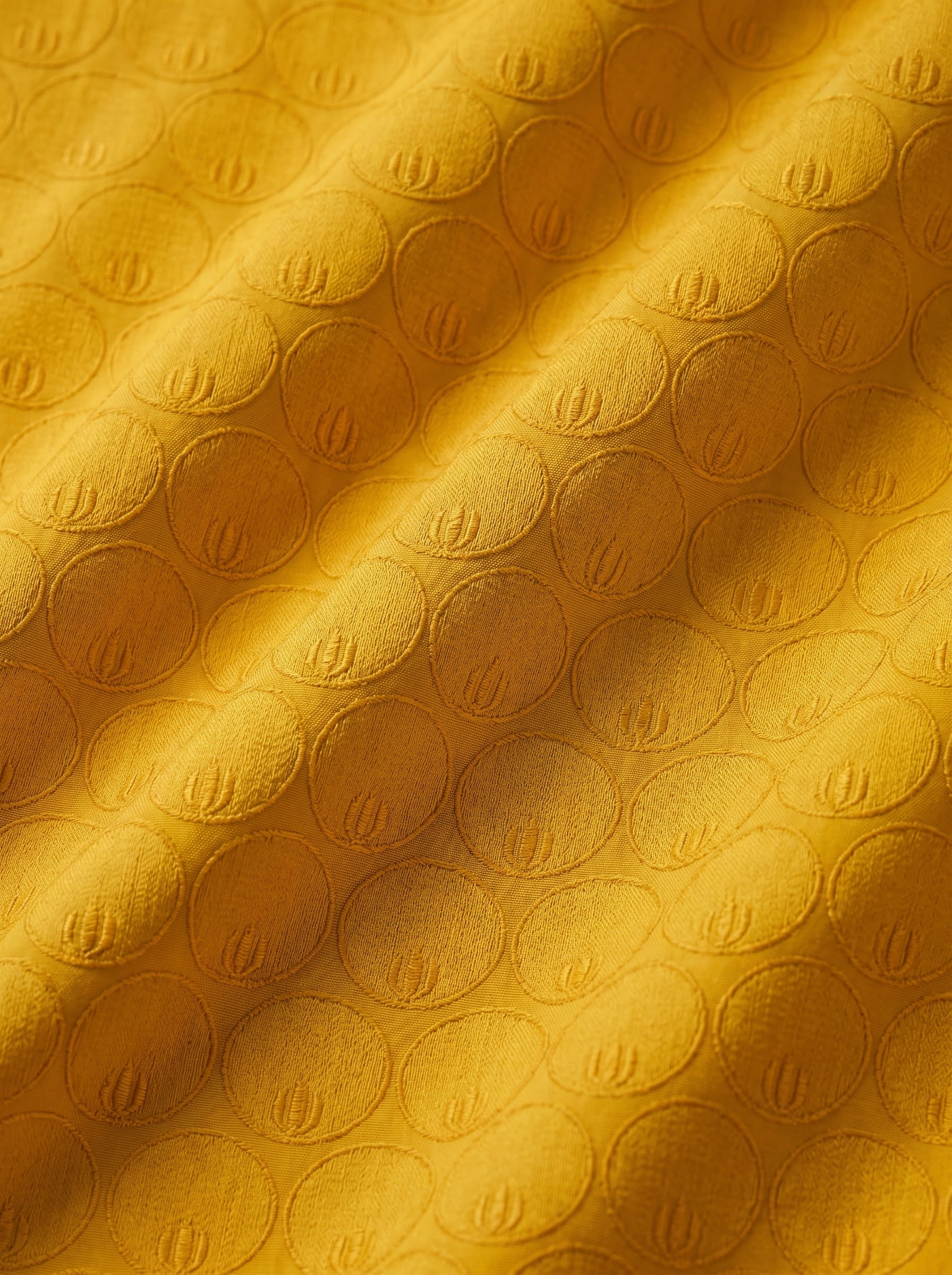 Rich mustard embroidery with heavy cutwork border