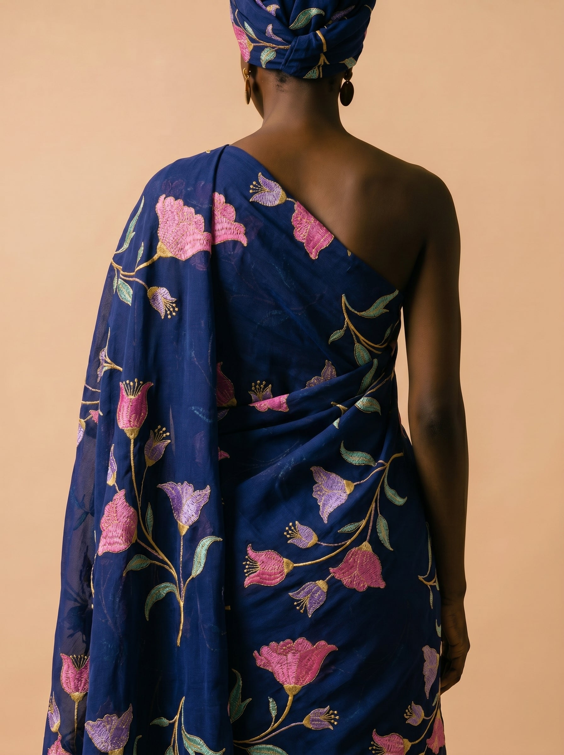 Vibrant floral embroidery on deep navy voile