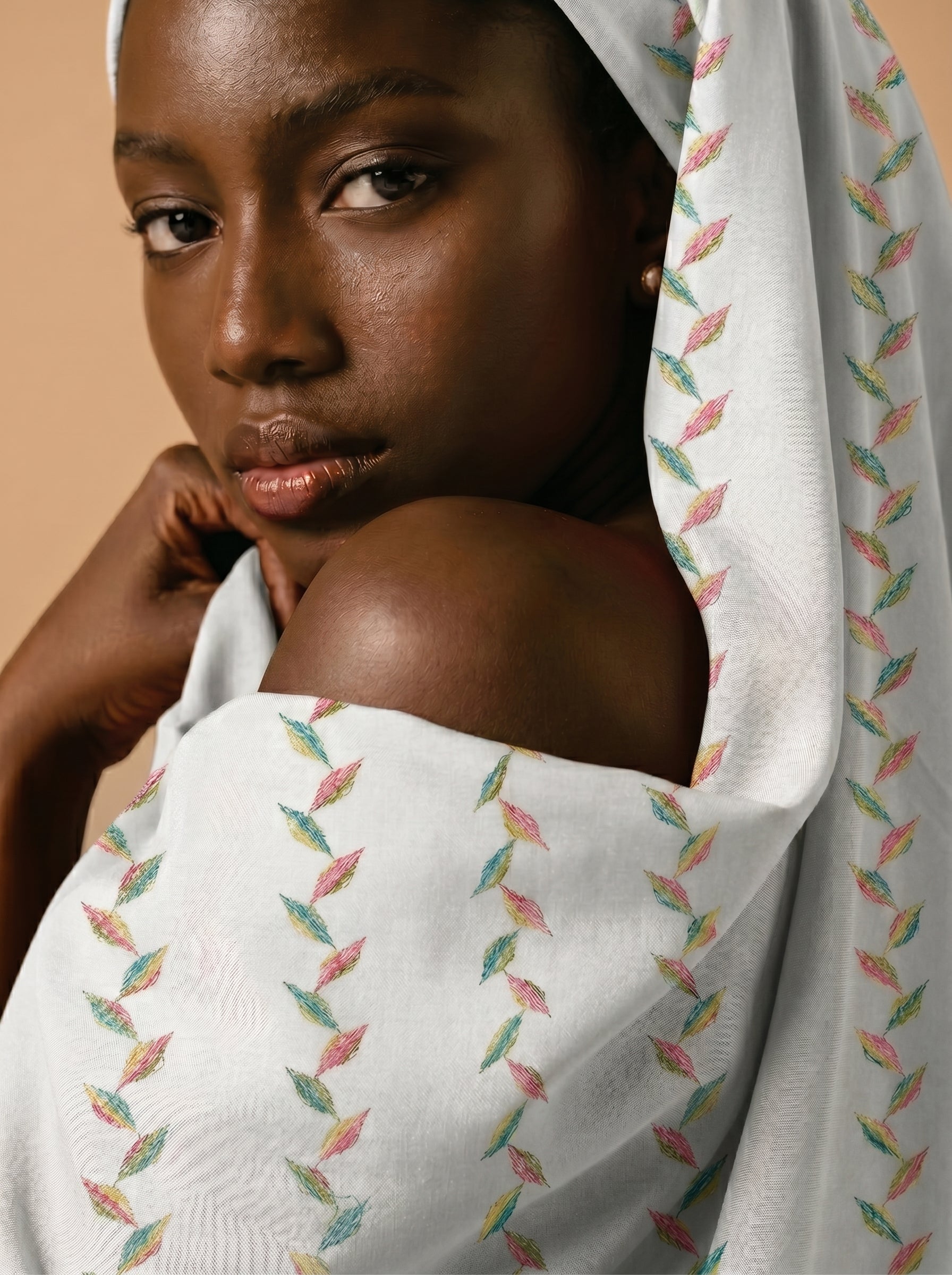 Multicolour embroidery on soft white cotton