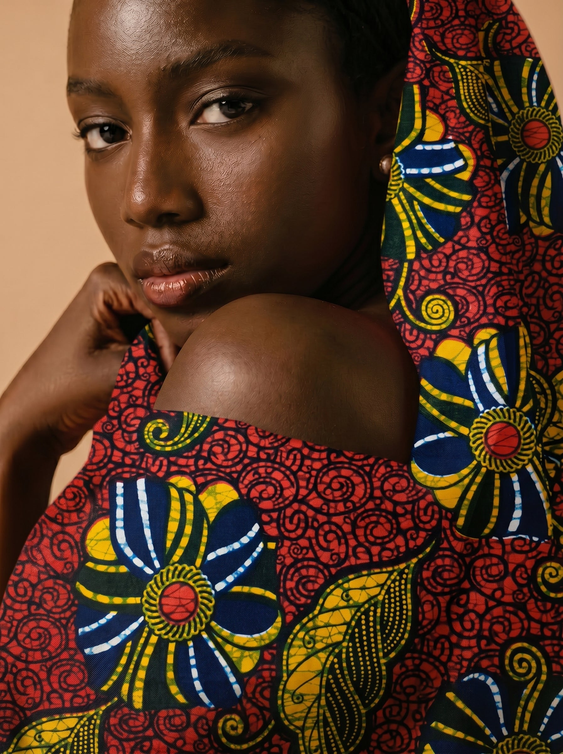 Bold floral wax print on rich red