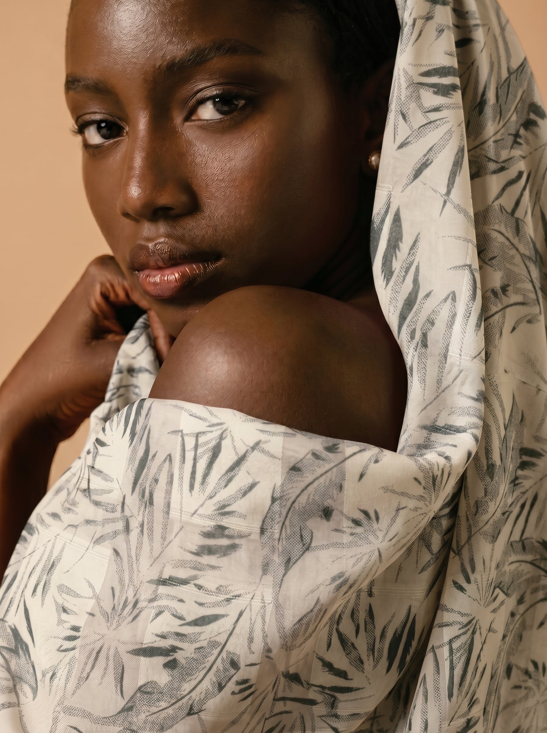 Unstitched Swiss voile featuring nature-inspired leaf motifs and intricate embroidery work