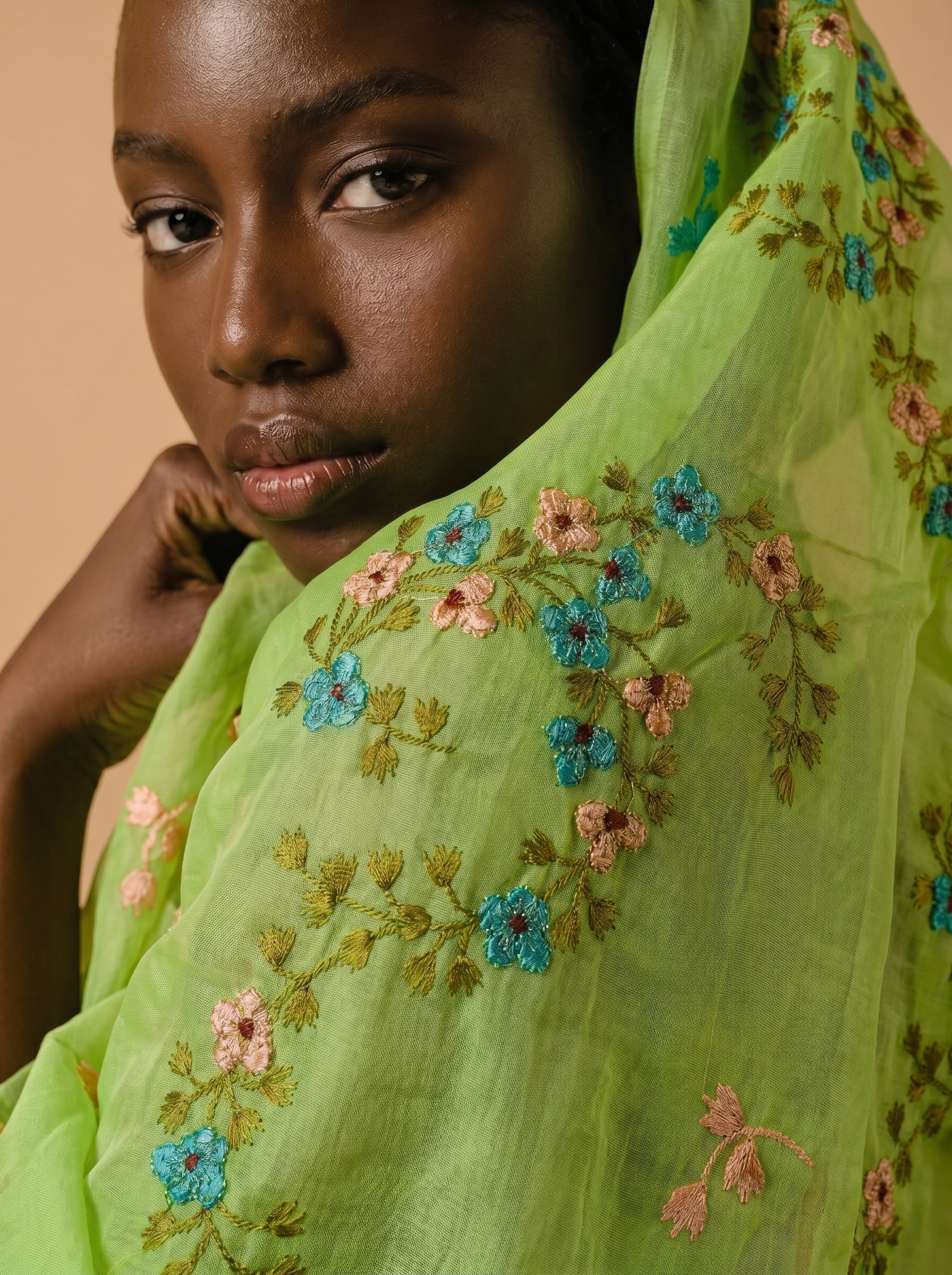 Fresh lime base with delicate floral embroidery