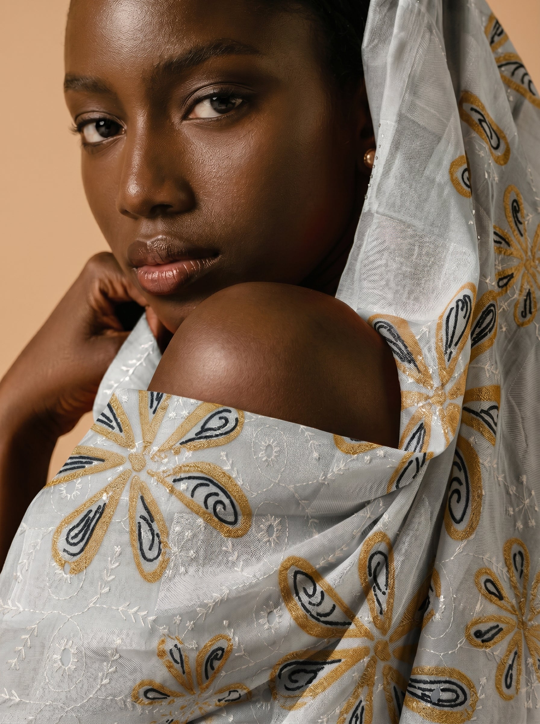 Embroidered motif fabric